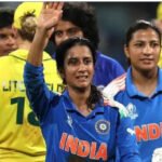The Indian Women’s team lifting the World Cup trophy amid fireworks