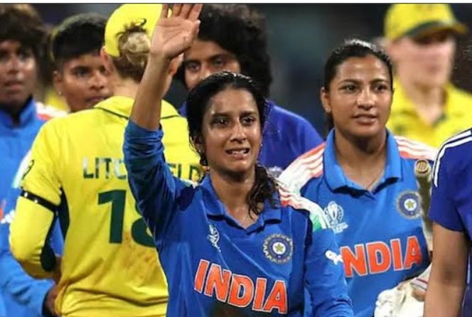 The Indian Women’s team lifting the World Cup trophy amid fireworks