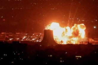 WHO Warns of Health Risks From “Black Rain” After Strikes on Iran Oil Facilities