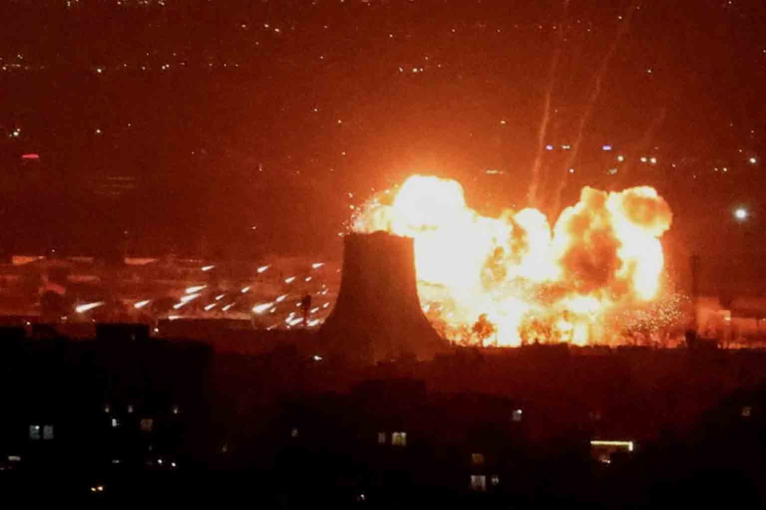 WHO Warns of Health Risks From “Black Rain” After Strikes on Iran Oil Facilities