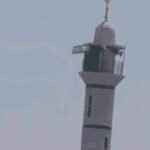 Israeli flag on the minaret of Abu Ubaida Mosque