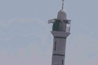 Israeli flag on the minaret of Abu Ubaida Mosque